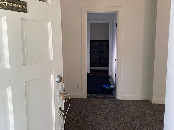 Entrance into living room. You can see the dining room and past that is the hallway that leads to the BRs and Bathroom