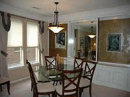 Formal Dining with art niche, window treatments 