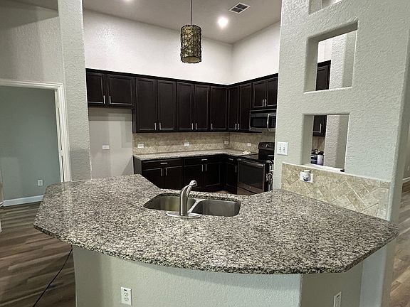 Kitchen is open to dining and living space