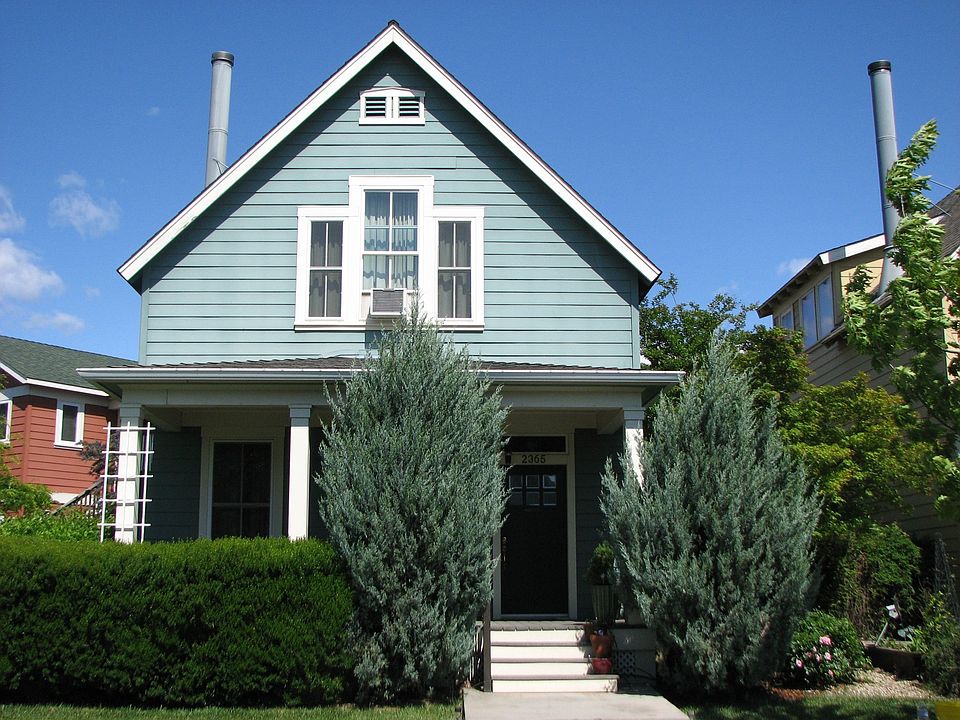 Front-notice large front porch, pricacy protected by landscaping