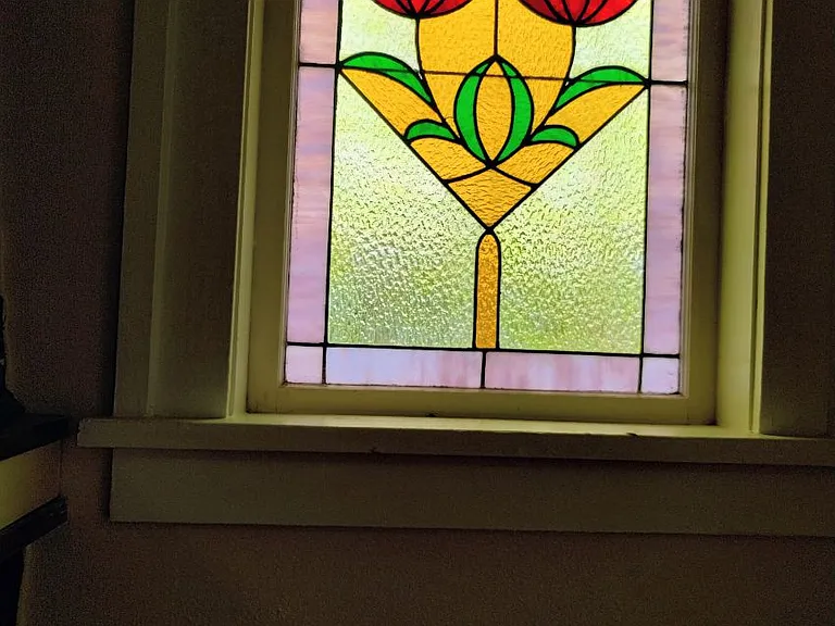 Stained glass windows by the fireplace