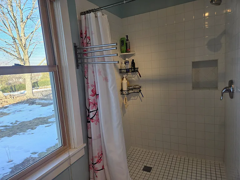 First floor bathroom with tiled shower