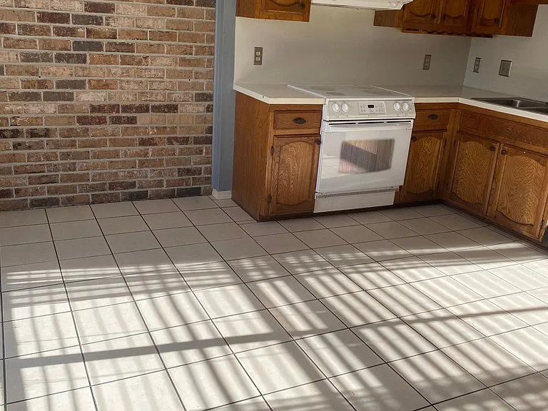 Kitchen with accent brick wall