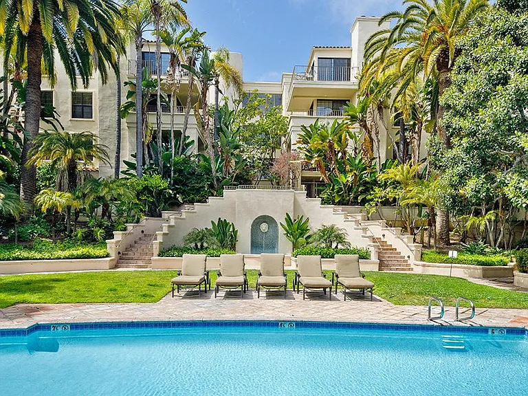 Resort-style heated pool with chaise lounges