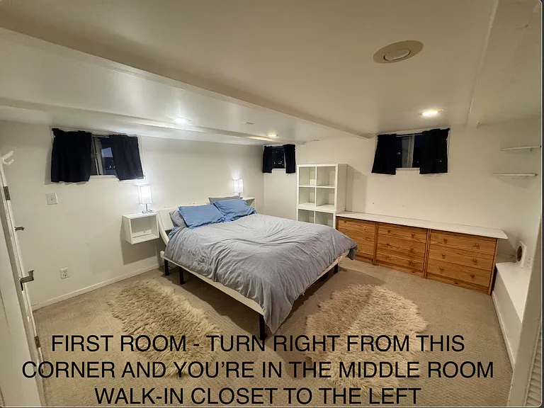 This is the first bedroom you get when you come down the spiral staircase. If you go right from here, you're in the middle room. A privacy divider here allows privacy for this room while people pass through this corner to get to the other rooms.
