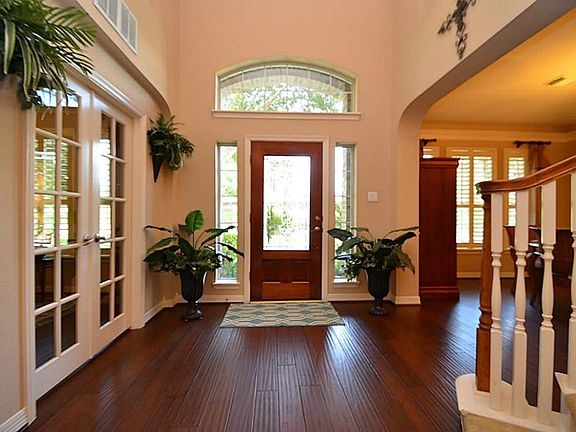 Great view of the entrance and bamboo hand scrapped hard wood floors.