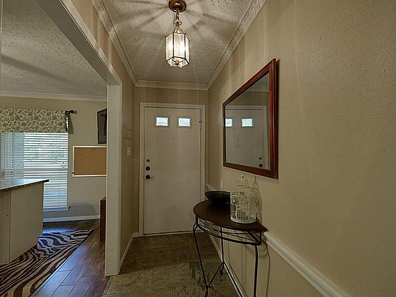 Classic Elegance as you enter the Foyer. Porcelain tile compliments the porcelain wood floors and welcomes you into this fantastic home.