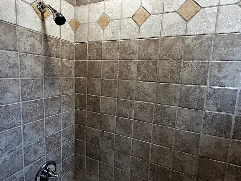 Stunning marble and ceramic tile shower and bath.
