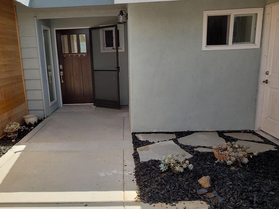 Courtyard entrance. Garage door on right. Washer and dryer inside.