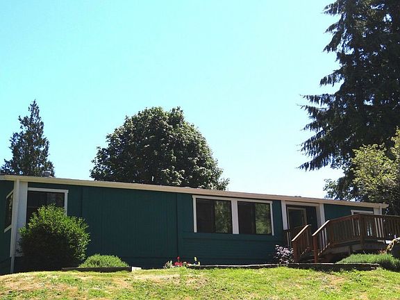 The home is situated so that while in the living room you take in the picturesque views of the great outdoors.  Nice big windows to do so! 