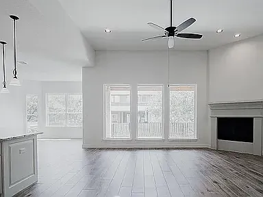 Family room with windows to the backyard; dining nook on the left