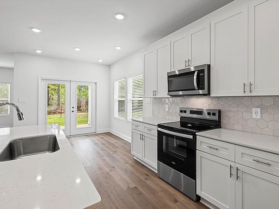 Kitchen in the Newport floorplan at a Meritage Homes community in Ocean Springs, MS.