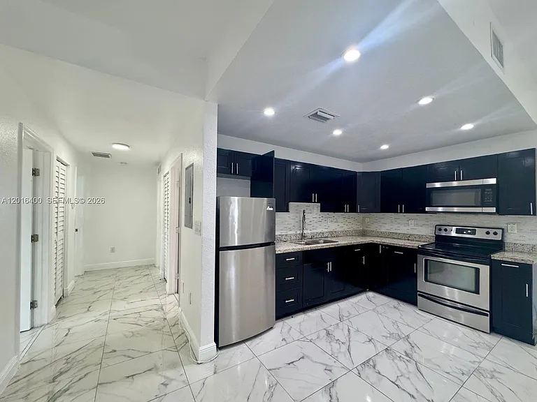 7703 NW 3rd Ave — Photo 1