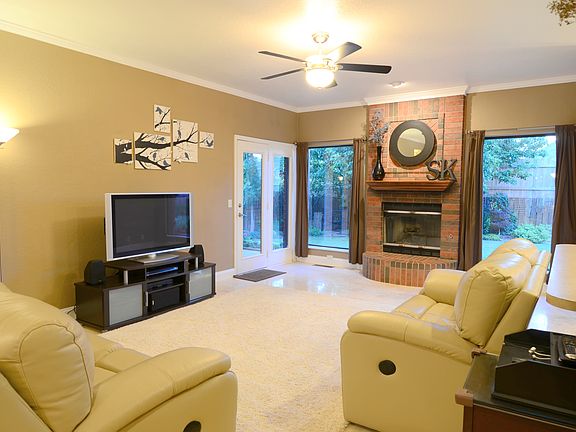 View of the living room and back yard from the front door.