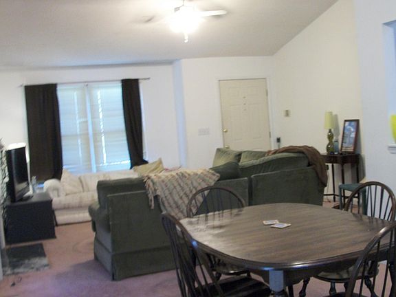 Dining area with living room in background