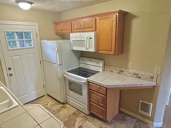 Kitchen with tile countertops