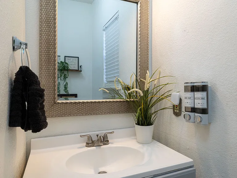 Bright, modern half bath with essential amenities.