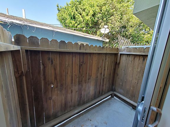 Small private ground patio great for bicycle storage or lounging outside!