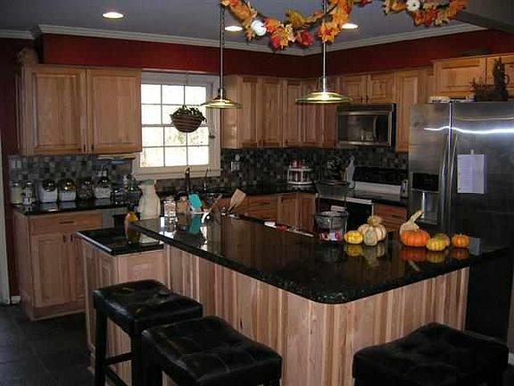 rennovated kitchen w/ granite counter tops, custom cabinets