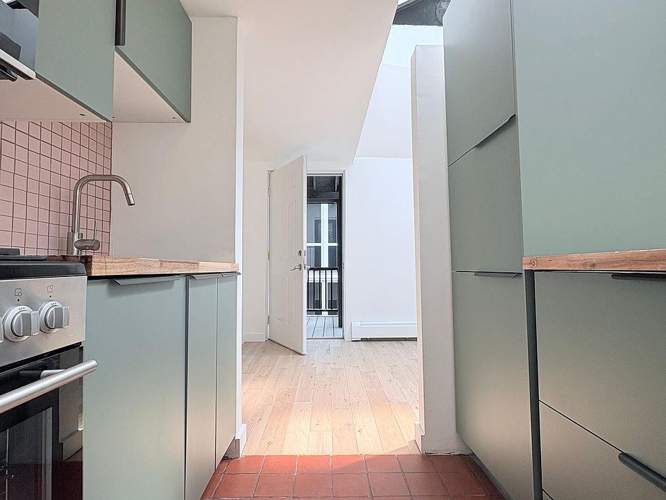 Kitchen looking toward apt entrance