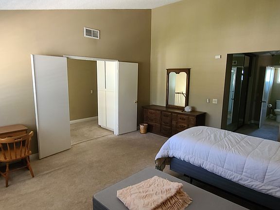 Master Bedroom looking at top of stairs, His and Hers closets, and en suite bathroom (I have to update this picture to include the queen bed)