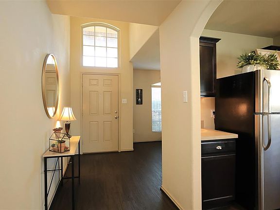 ENTRY - Large window over front door lets in lots of natural light.