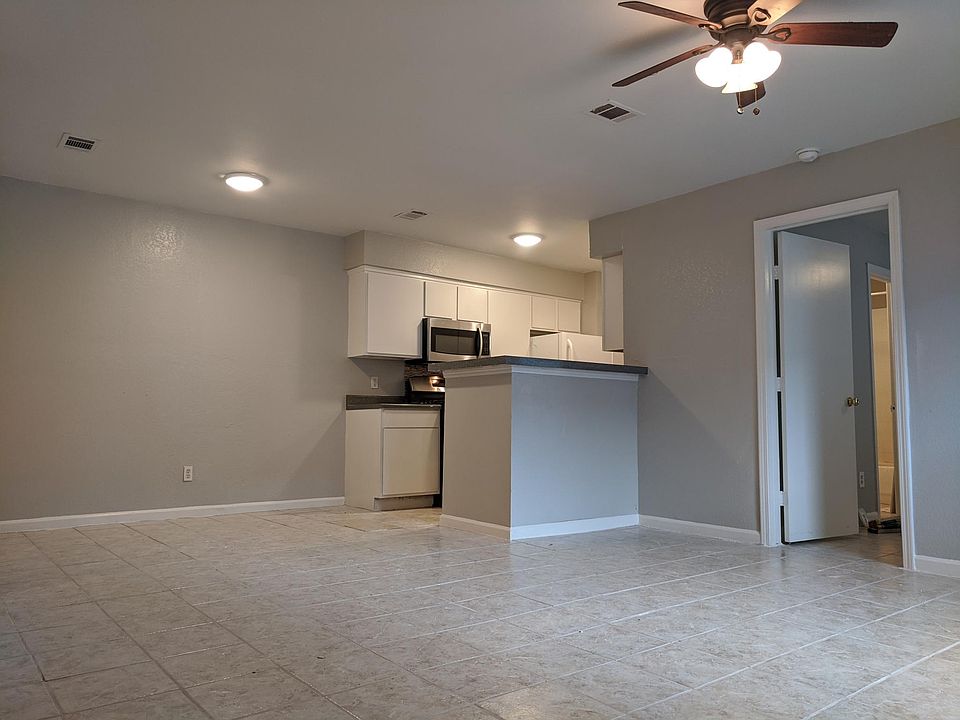 Living room, dining area, and open kitchen. Master suite to right