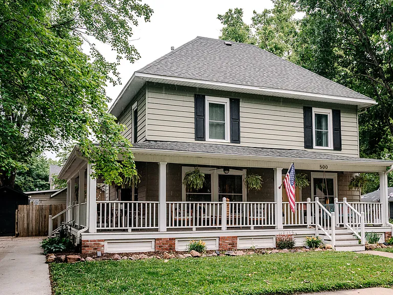 Wrap around porch in front of the city park pond!