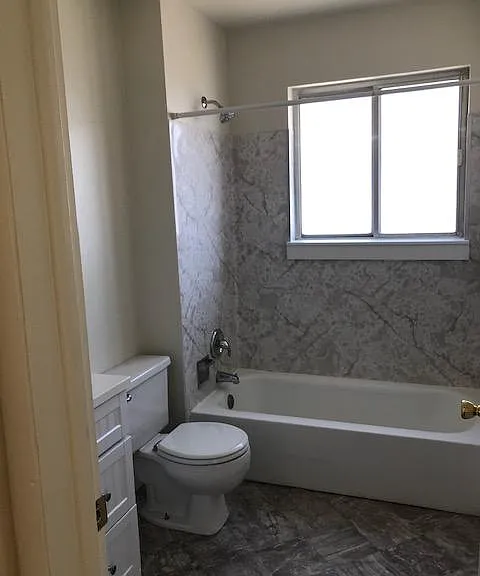 Bathroom windows have curtains which are water proof.