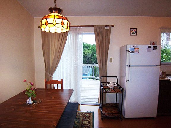 Dining area off Kitchen with sliding door to deck