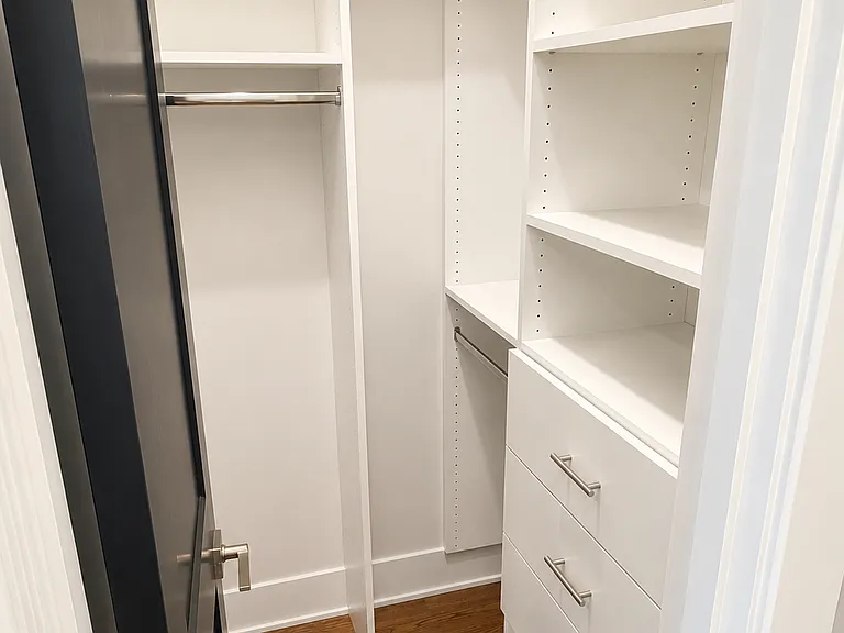 One of two walk in closets in the Primary Bedroom Suite