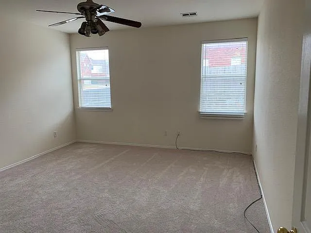 Natural light in large Master bedroom that can easily fit a king sized bed. Master on the first floor.