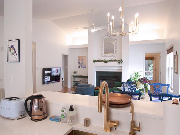 gold toned kitchen sink with a built in sink cleaner wand, reverse osmosis water filter and more