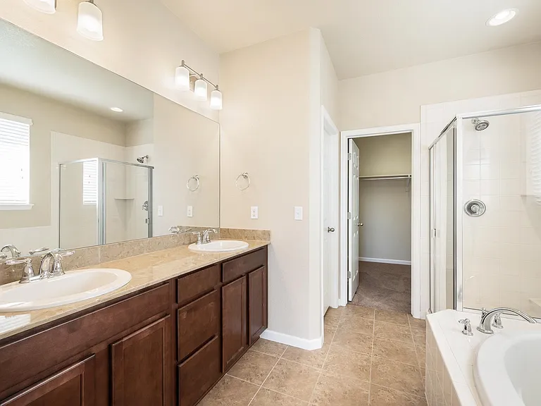 Master bath with double-sized walk-in closet
