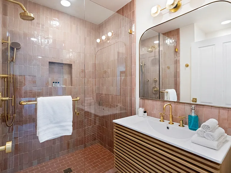 Modern elegance meets vintage charm in this luxe en-suite.