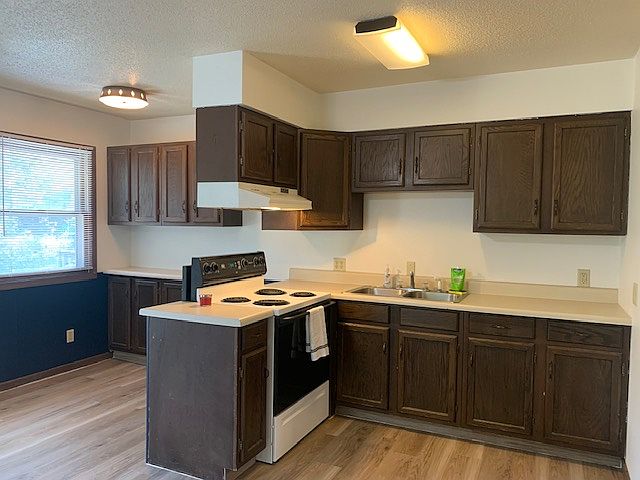Kitchen with open view to dining and living space
