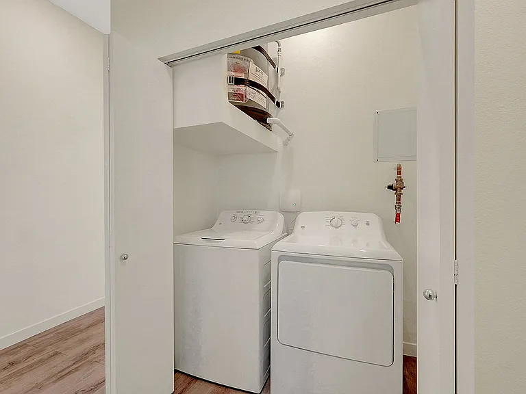 Experience convenient living with an in-unit laundry setup.