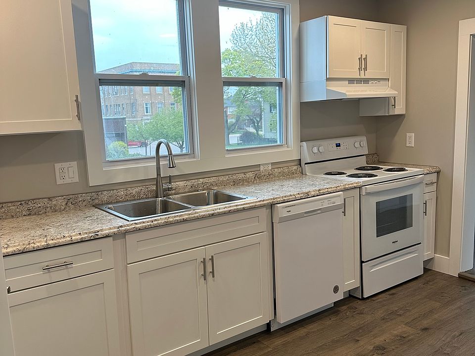 Kitchen with dishwasher, range and refrigerator. Great windows looking west toward the lake and downtown St. Joseph.