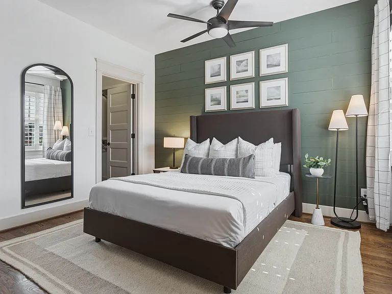 Find a comfortable queen bed in bedroom 3, along with a walk-in closet, dresser, smart TV, and ceiling fan.