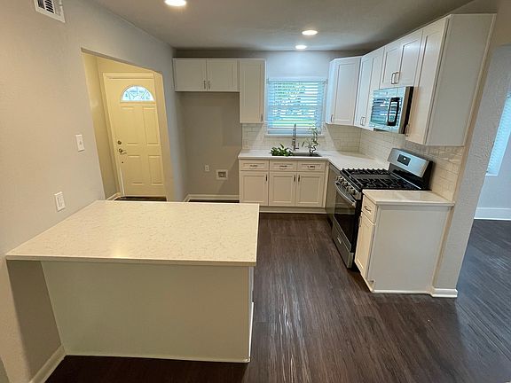 Updated kitchen, quartz countertops (fridge will be included)