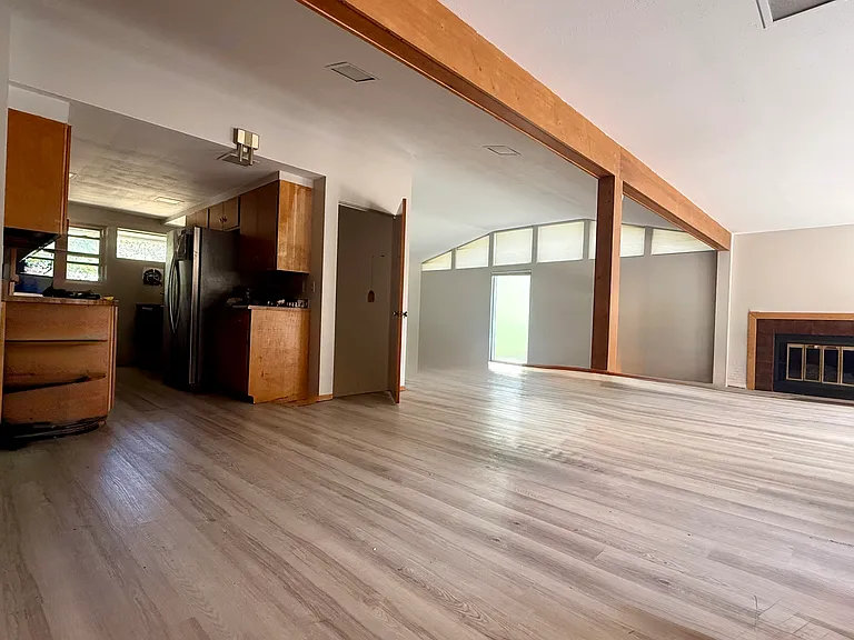 (Mudroom/Pantry & 1st ba @ L not seen)(cw fr left) kitchen, door to basement, LR (leads to front door), Family room, wall of S windows w/ 2 exits to deck (behind, not seen), dining room (standing in), (stairs up, then back hall, to L, not seen. Fsc