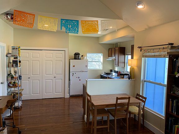 view of laundry and kitchen from living room