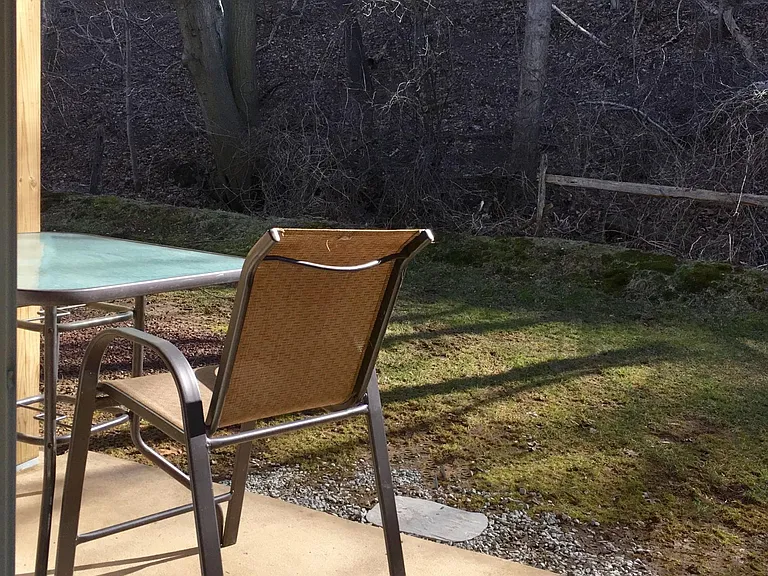 private outdoor patio backing to woods.