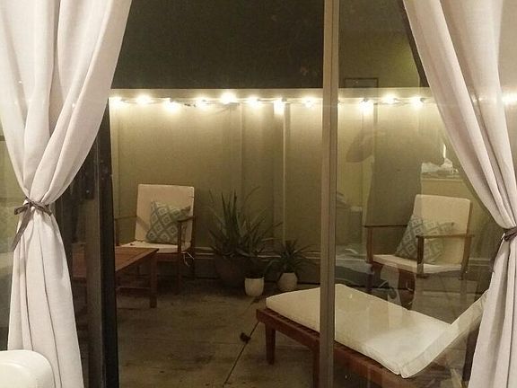 Front Lanai lit up at night from the living room