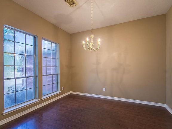 Dining room offset from the kitchen in the front of the house.