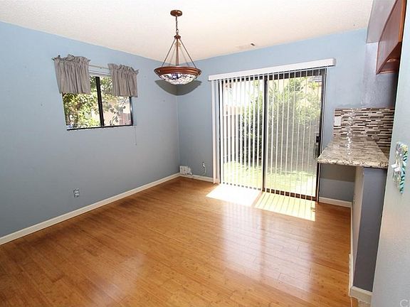 Dining Room- newly updated bamboo floors, chandelier, bar wi