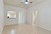 High ceilings with crown molding. All tile in living, kitchen, dining, and 3 bathrooms