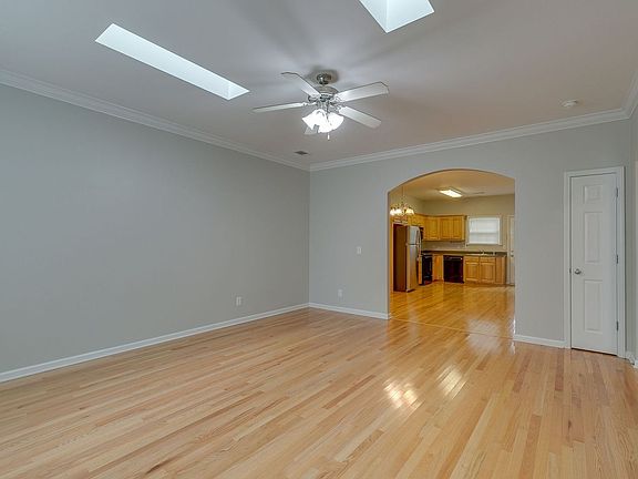 Living area looking into kitchen/dining.