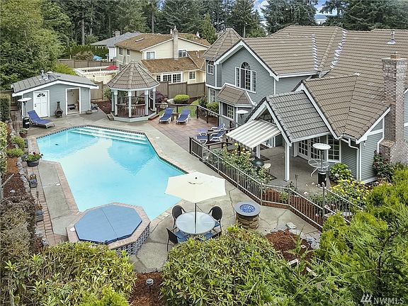 Unlimited 'smileage' from your private, fenced, back yard fun!  Beautiful pool and hardscapes.