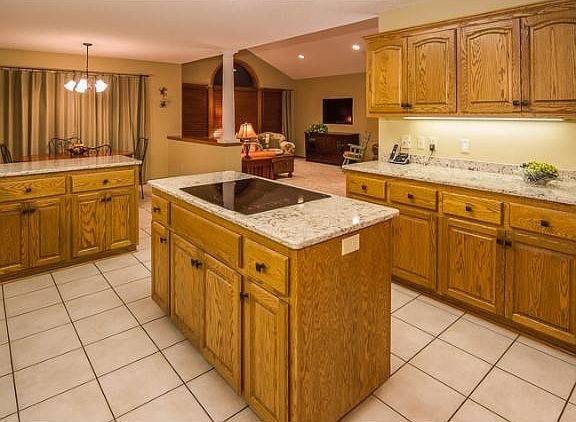 Cambria counters with brushed nickel Jenn-aire appliances and a large pantry closet.  Large Mudroom access's this large welcoming kitchen